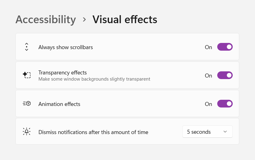 A Windows 11 settings panel subsection. The title of the panel is 'Accessibility > Visual Effects'. There are four options present, the first three with a switch control and last with a dropdown. The first option is titled, 'Always show scrollbars'. The second option is titled, 'Transparency effects'. The third option is titled, 'Animation effects'. The fourth option is titled, 'Dismiss notifcations after this amount of time'. All three switches are set to the on position, including the option to always show scrollbars. The dismiss notifications option is set to 5 seconds. Cropped screenshot.